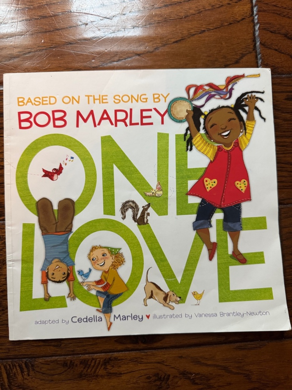 Scholastic White Cover with Orange, Green and Yellow Accents